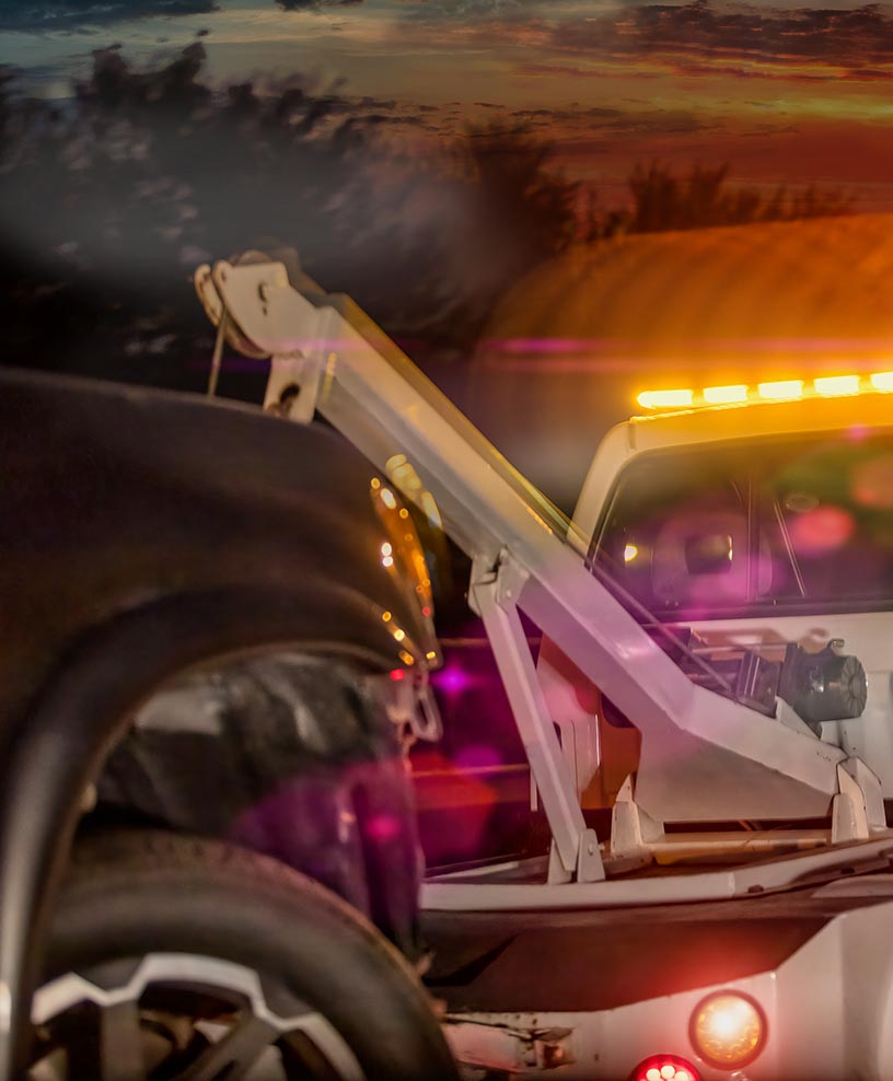 Tow truck with emergency lights ready for a recovery call